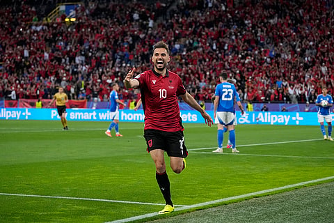 Nedim Bajrami celebrates after scoring a goal
